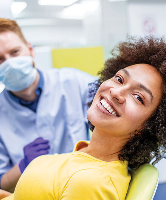 smiling woman sitting in a dental chair